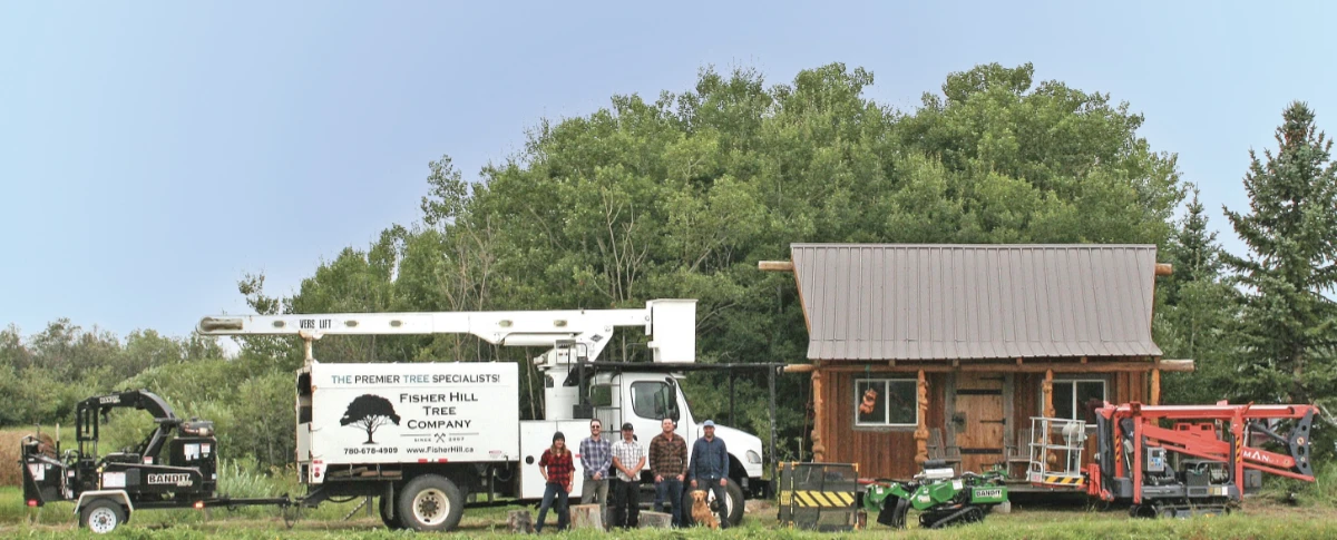 Fisher Hill Tree Company team photo in front of truck on farmland